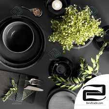 Table setting in black colors set of dishes, tableware