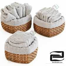 The decor of the bathroom Terry towels in wicker baskets