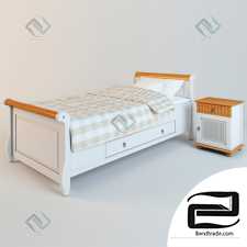 Children's bed with a bedside table