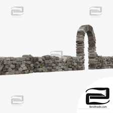Stone retaining wall with an arch. 