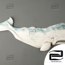 Wood wall decor in the shape of a whale