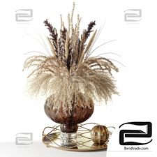 Bouquet of dried flowers in a pot-bellied brown vase on a tray